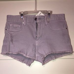 Distressed lilac high-waisted denim shorts